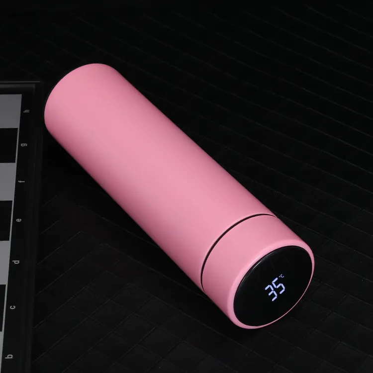 Four insulated bottles in gold, black, blue and pink, the pink one lying down showing the temperature display